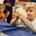James Barde watches as a exothermic chemical reaction happens in his hands during Hot & Cold Chemistry, one of Ann Arbor Hands-On Museum's Hands-On Holidays: Hot vs. Cold exhibits  Jan. 5. 
Courtney Sacco I AnnArbor.com   